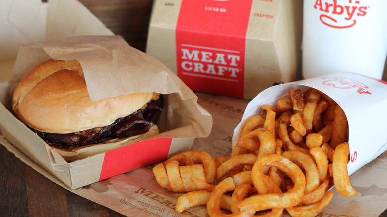 Arby's Quarter Pound Chopped Brisket Sandwich in box next to curly fries