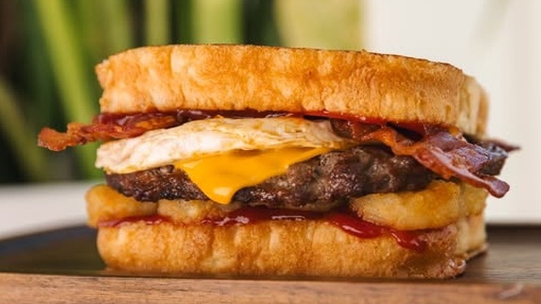 a close-up of a Hardee's Frisco Breakfast Burger