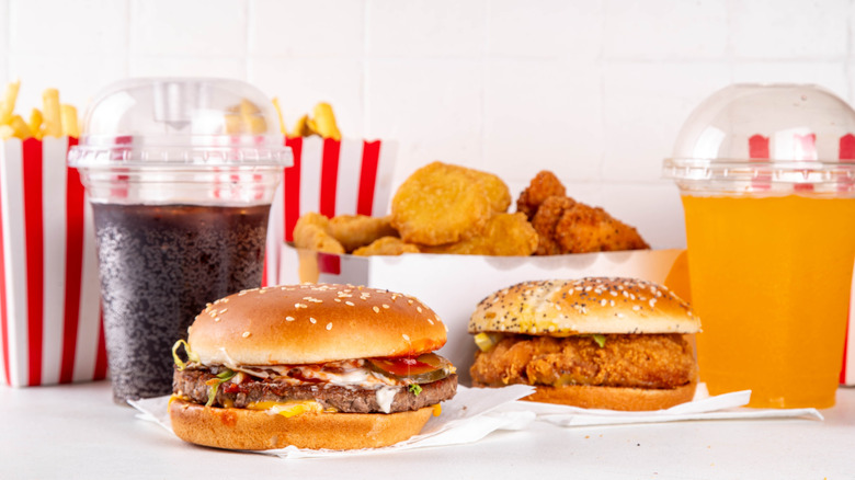 selection of fast food including fries drinks and sandwiches