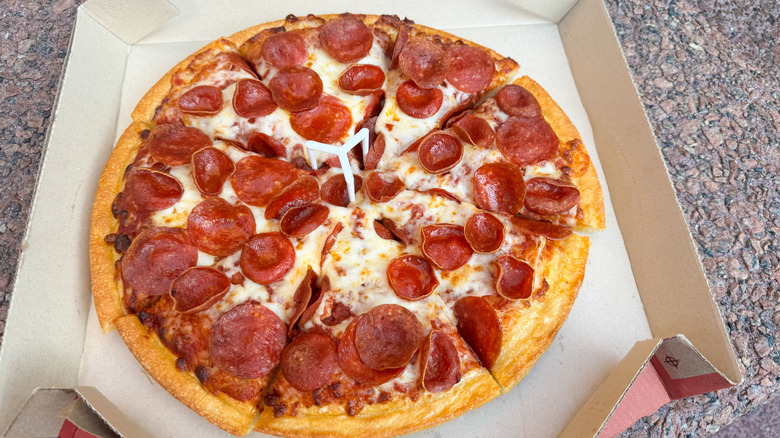 An original pan Tavern-style double pepperoni pizza takeout from Pizza Hut