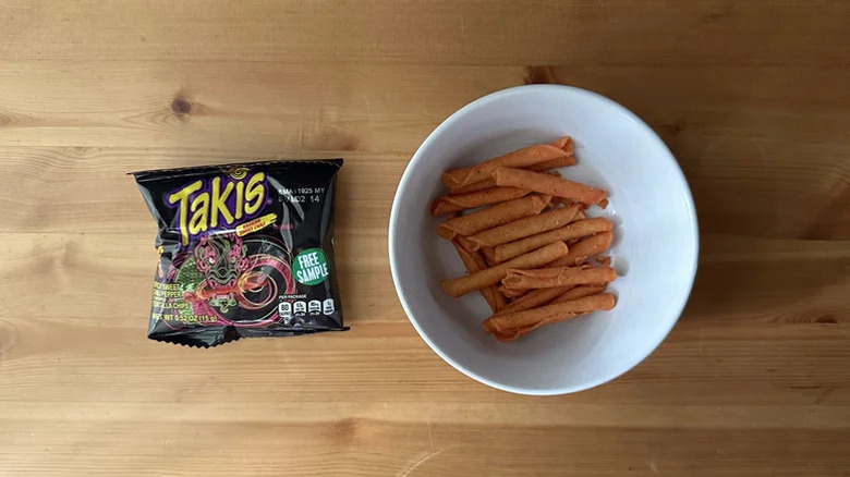 Takis Dragon Sweet Chili bag next to chips in white bowl