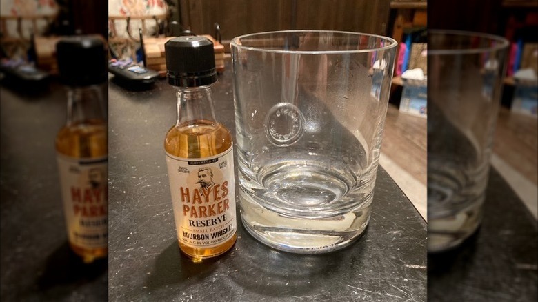Small bottle of Hayes Parker Bourbon and glass