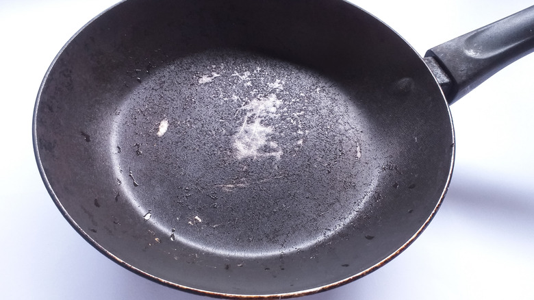 An inner view of a scratched non-stick pan