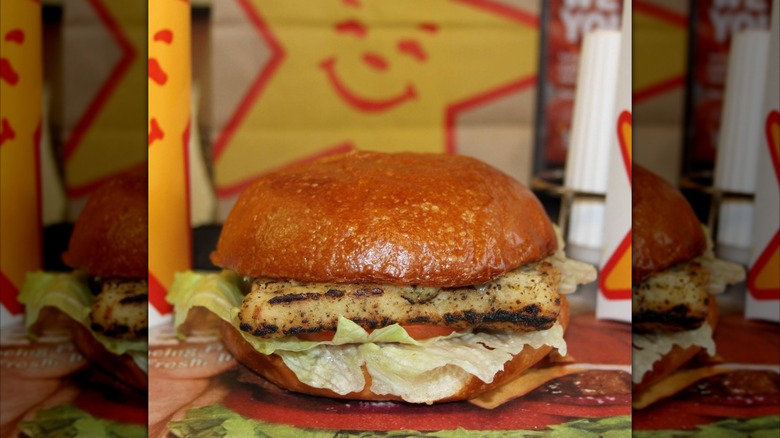 Charbroiled Atlantic cod fish sandwich with the Carl's Jr. star logo on a paper bag