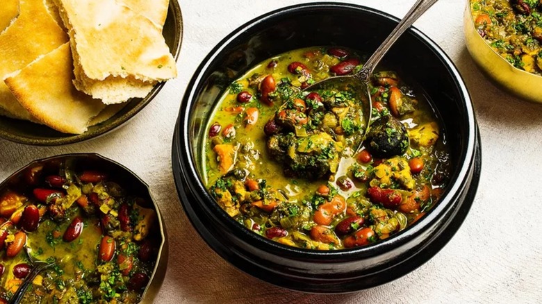 Bowl of ghormeh sabzi with spoon