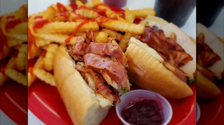 Close-up of a hot turkey club sub with fries