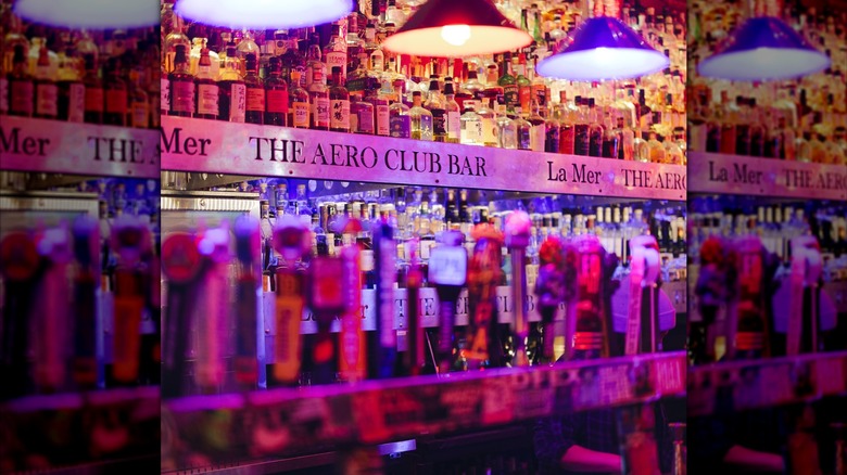 Shelves of whiskey bottles at the Aero Club Bar