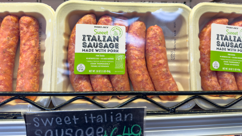 Packages of Trader Joe's Italian sausage in a store refrigerated section