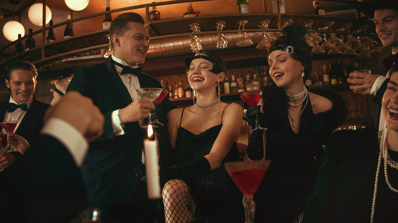 A retro 1920s style bar scene with people drinking cocktails
