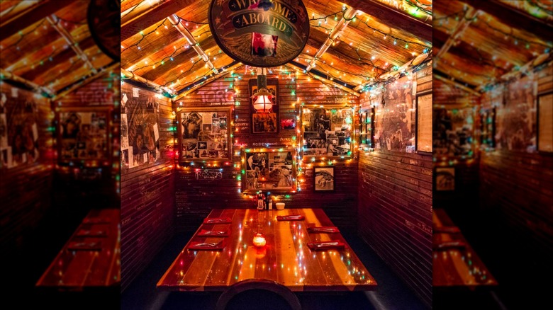Nautical-themed interior of The Galley lit by holiday lights