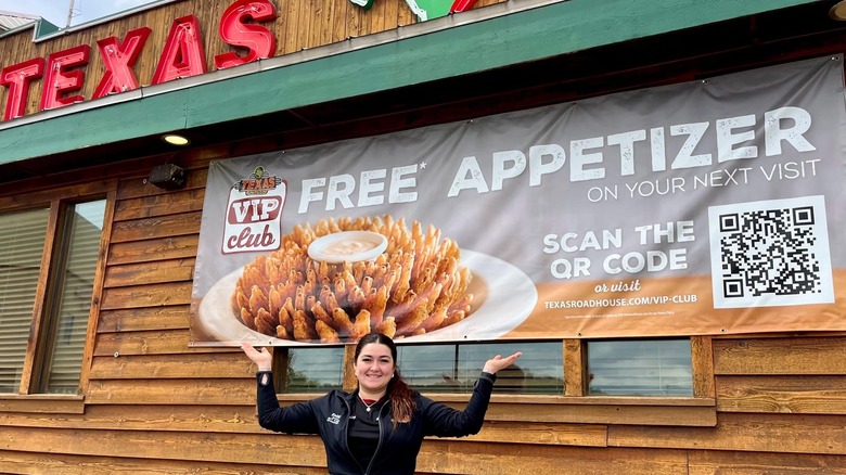 A banner for the Texas Roadhouse VIP club on the side of the restaurant