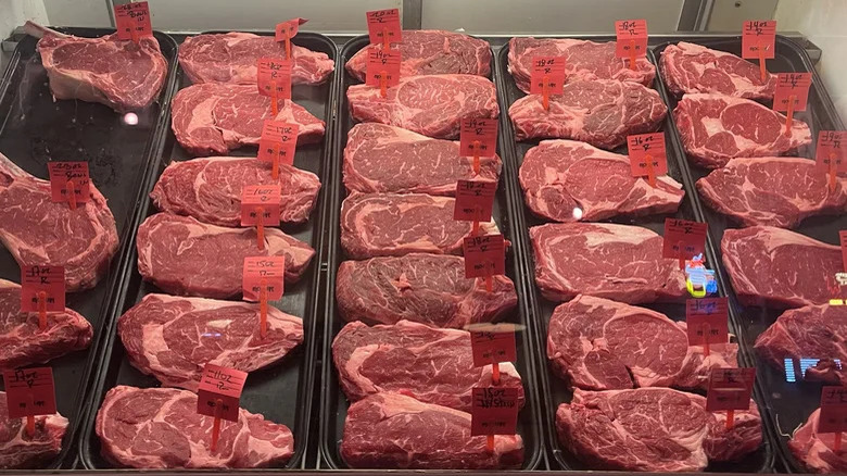 A selection of raw steak cuts in trays