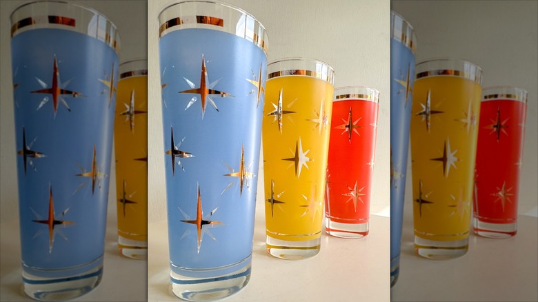 Three Bartlett-Collins atomic North Star tumblers in blue, yellow, and red