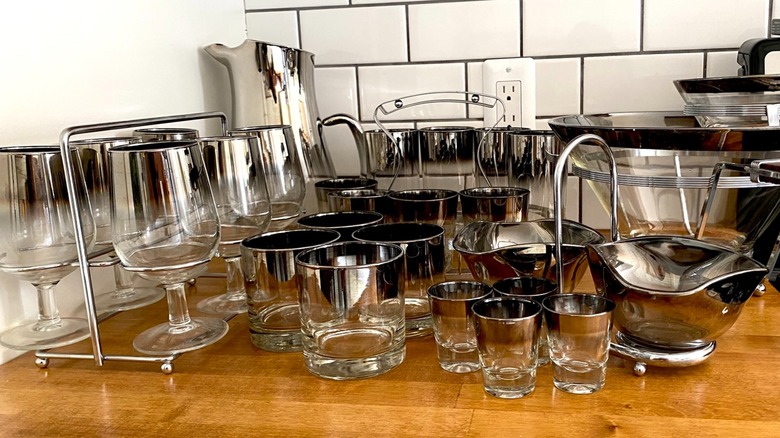 Set of silver Lusterware glasses including rocks and shot glasses