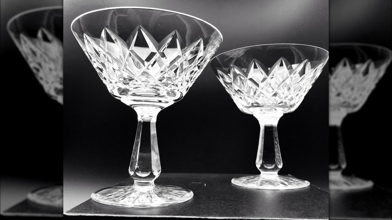 Pair of Waterford Crystal champagne coupe glasses on a black background