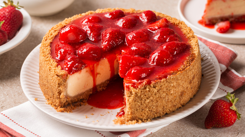 strawberry cheesecake with one slice taken out