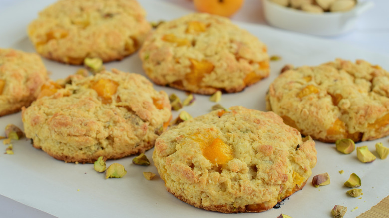 apricot pistachio scones on white baking sheet