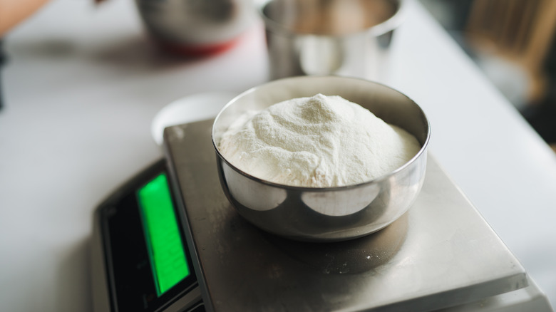 weighing flour on digital scale