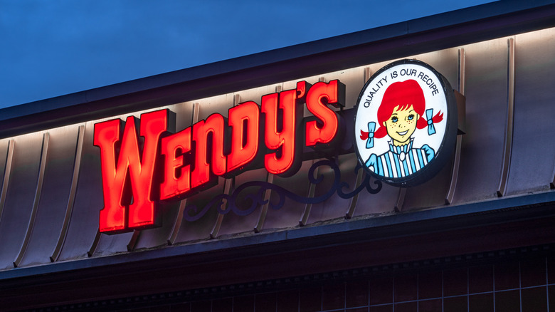 Glowing Wendy's sign on exterior of building