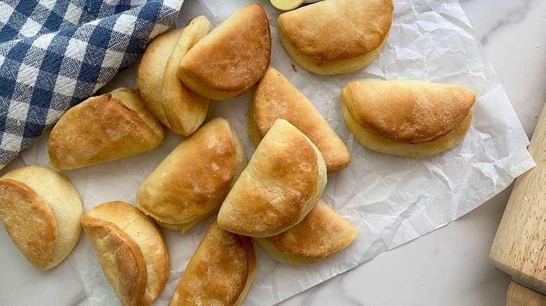 Parker House rolls on a piece of parchment paper