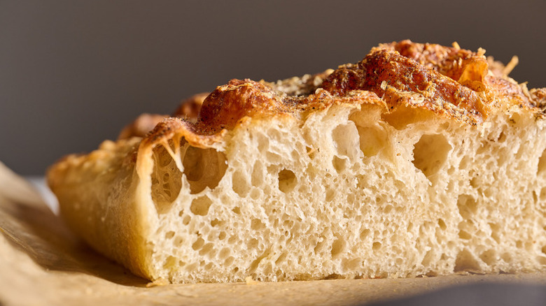 Close-up of a fluffy slice of focaccia bread