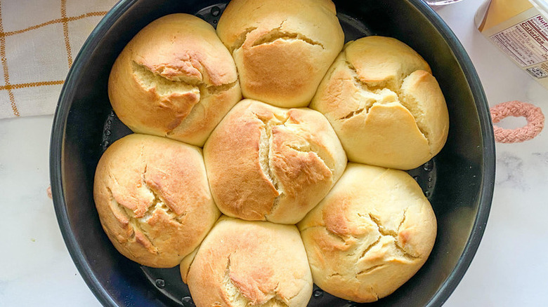 Portuguese sweet bread rolls in a round baking dish