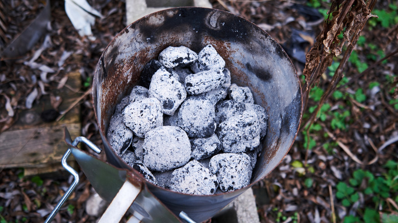 White ashy coals in a coal chimney.