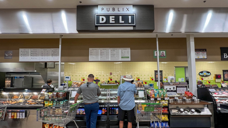 Customers ordering at a Publix deli