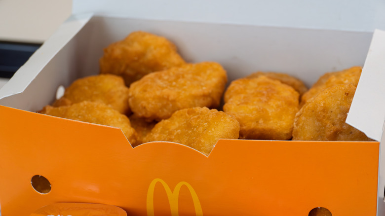 An orange box filled with chicken McNuggets