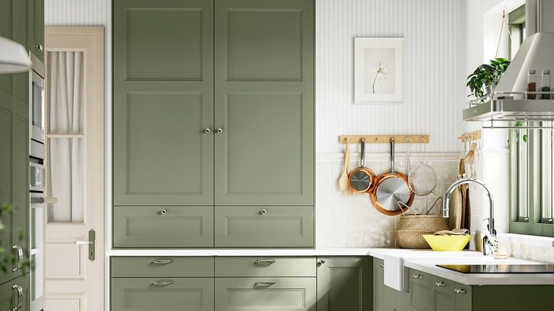 White kitchen with gray green Ikea AXSTAD cabinets