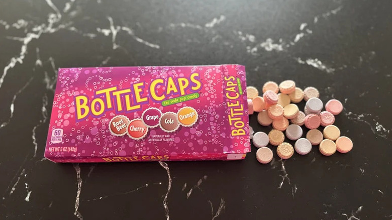 Box of Bottle Caps spilled onto countertop