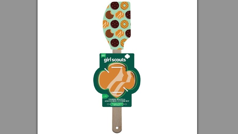 Girl Scouts branded rubber spatula with cookie themed print and Trefoil-shaped green cookie cutter