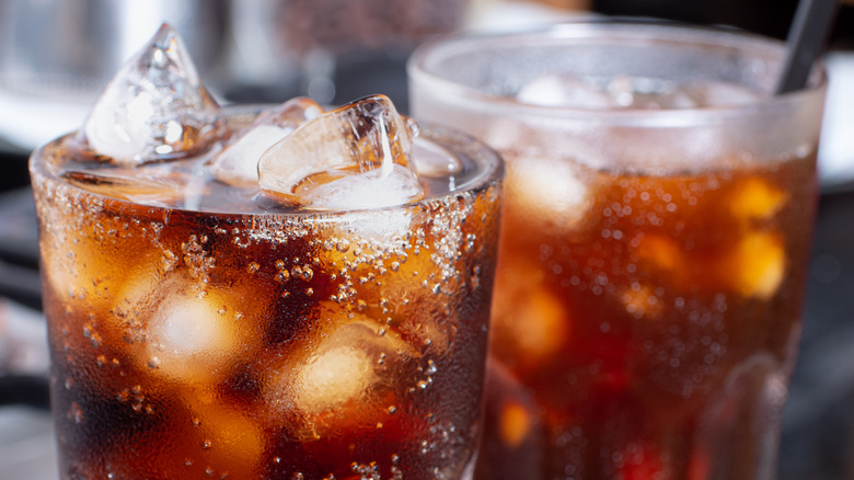 Close-up of two glasses of brown cola