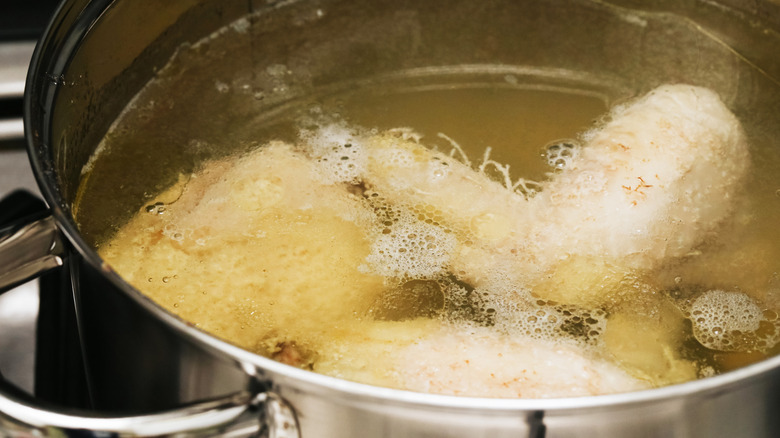 Meat boiling broth in pot