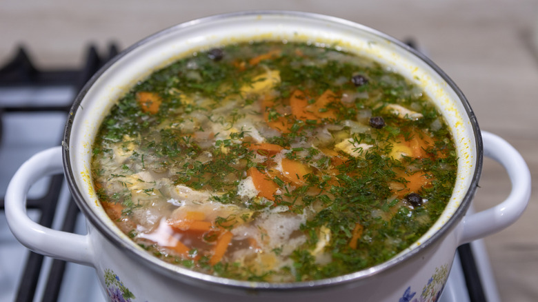 Vegetable soup simmering in pot