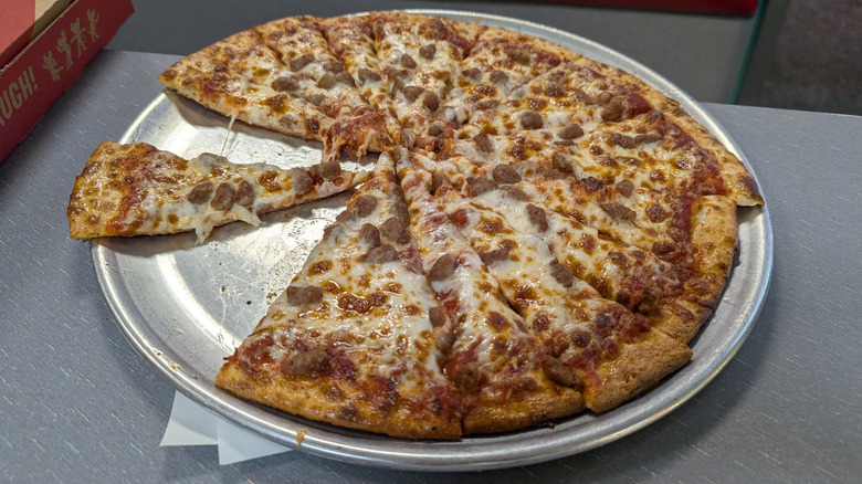 Chuck E. Cheese pizza on a restaurant table