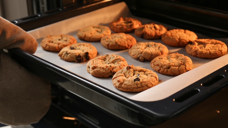 taking cookies out of oven