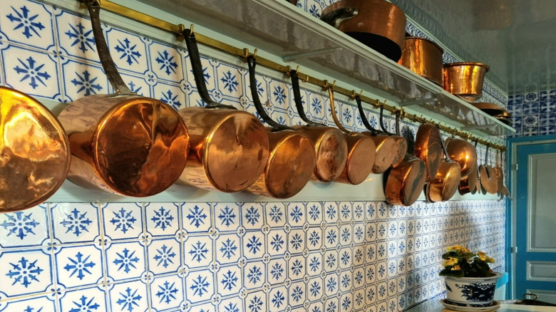 collection of antique copper pots