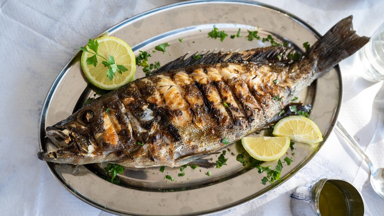 Whole grilled fish with lemon