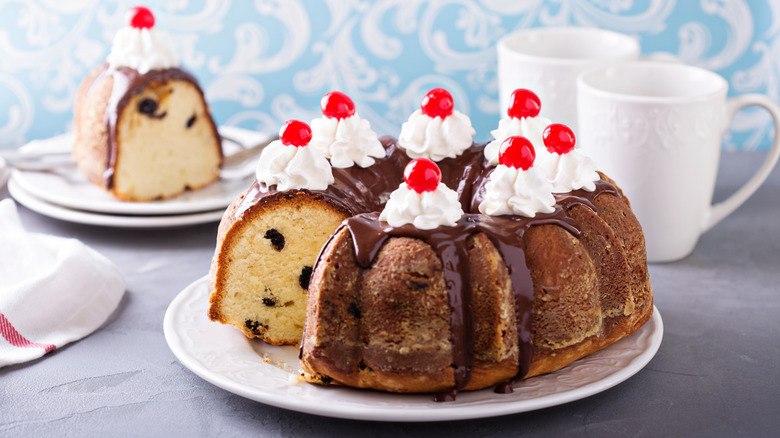 Bundt Cake with whipped topping and cheery