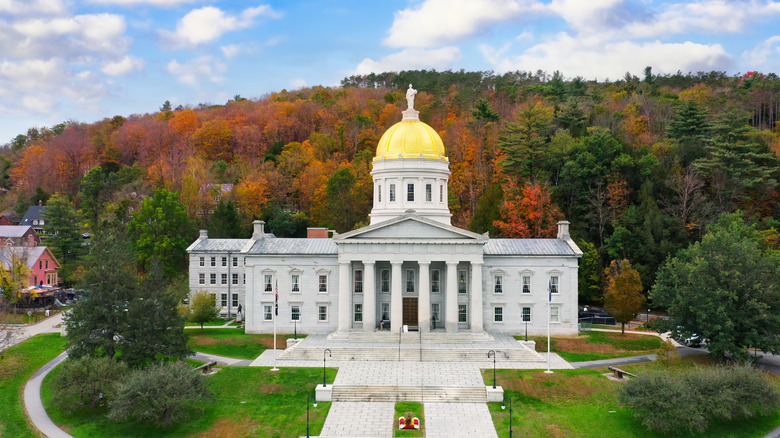 Vermont's capitol building with a gilded dome, pictured in autumn