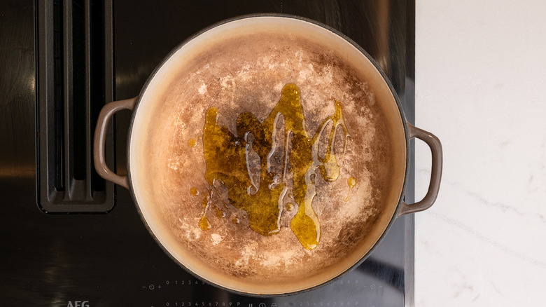 Aerial view of vegetable oil in a pan on hob