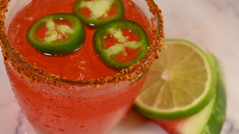 Strawberry margarita with spicy rim and jalapeños