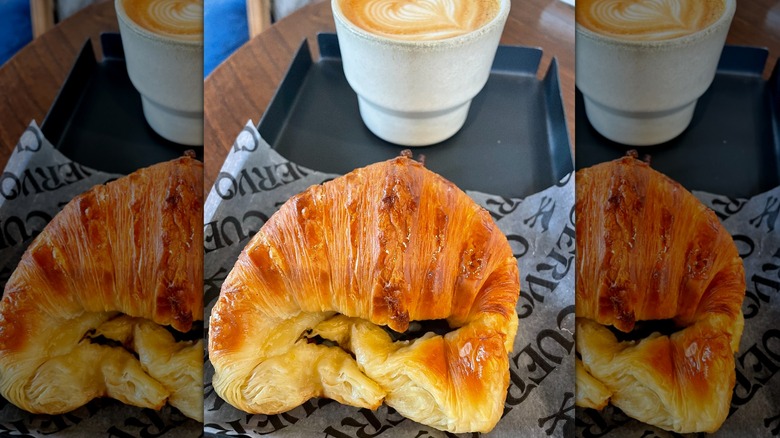 Closeup view of a medialuna and coffee from Cuervo Cafe in Buenos Aires
