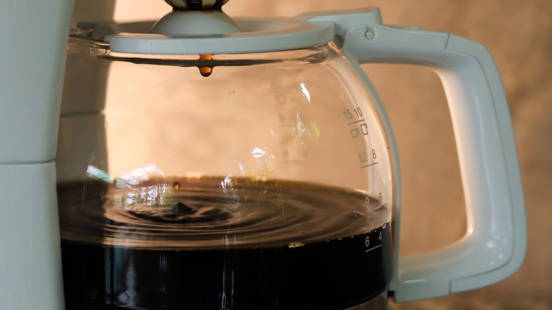 coffee drips from filter chamber in drip machine