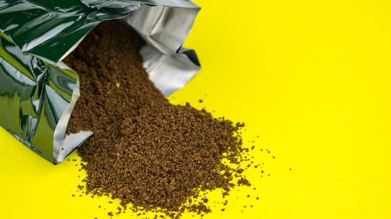 Ground coffee spilling out bag
