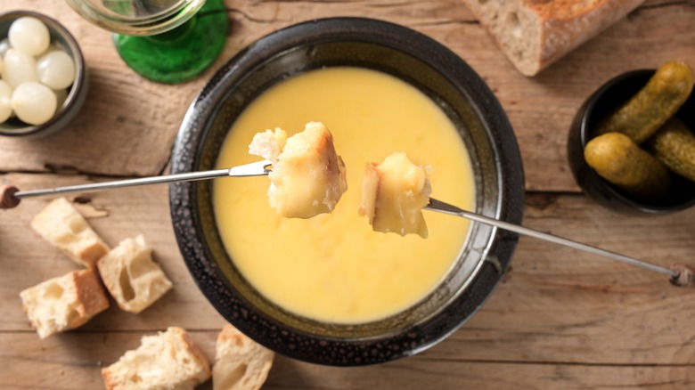 cheese fondue pot and pickles