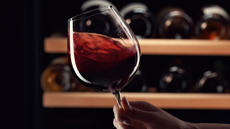 swirling glass of red wine 