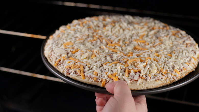frozen pizza into oven