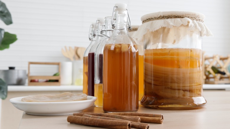 kombucha bottles and fermentation jar